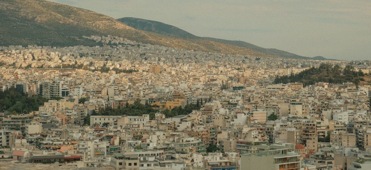 a view of a city with mountains in the background