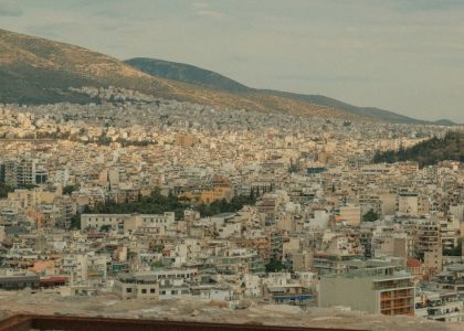 a view of a city with mountains in the background